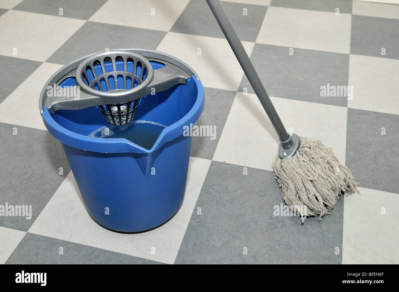 Somebody mopping a floor Stock Photo Alamy