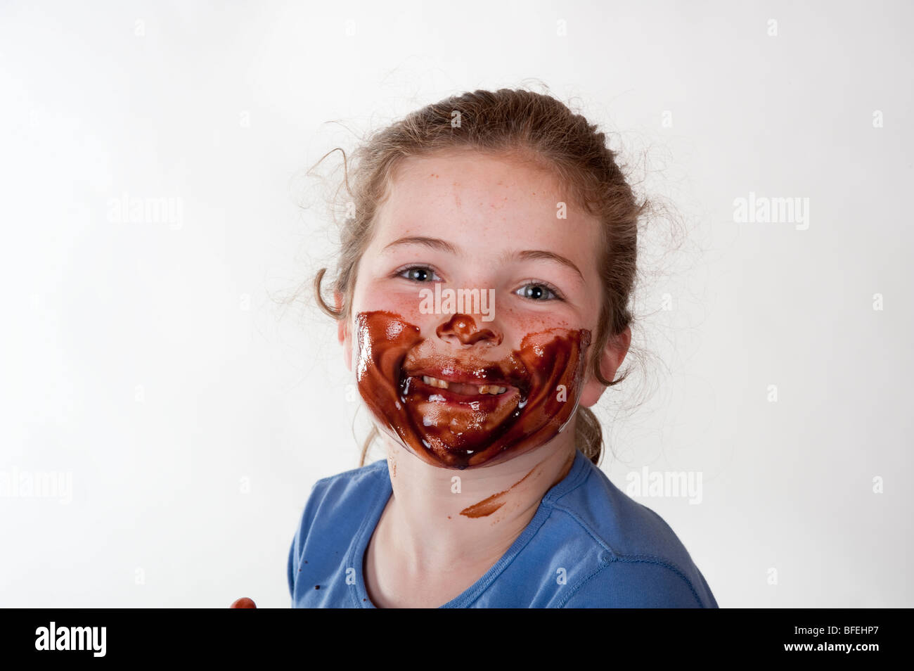 little girl with chocolate covered face Stock Photo
