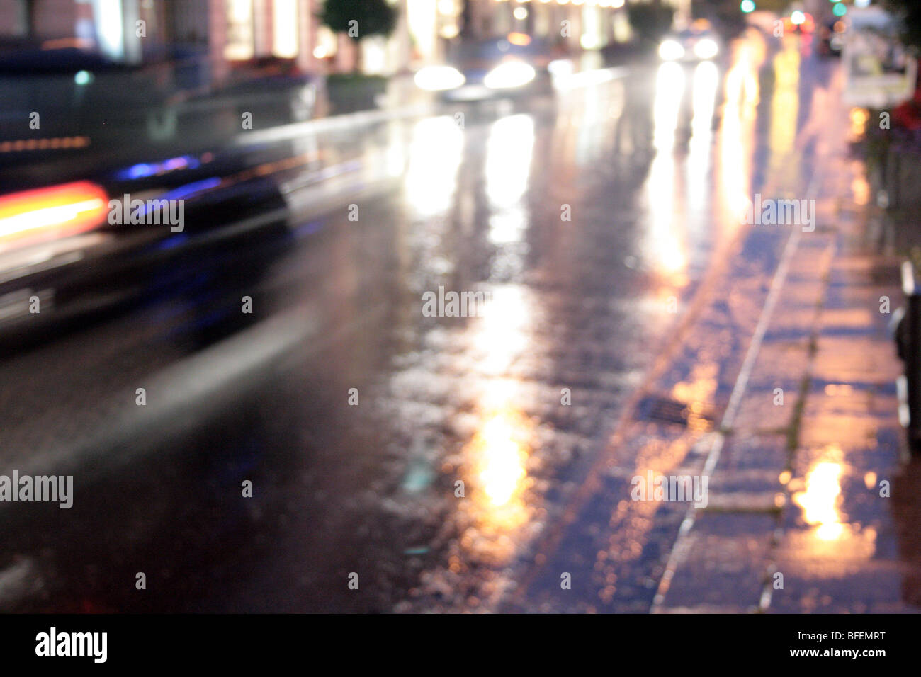 Cross town traffic on an autumnal stormy night in Munich Stock Photo