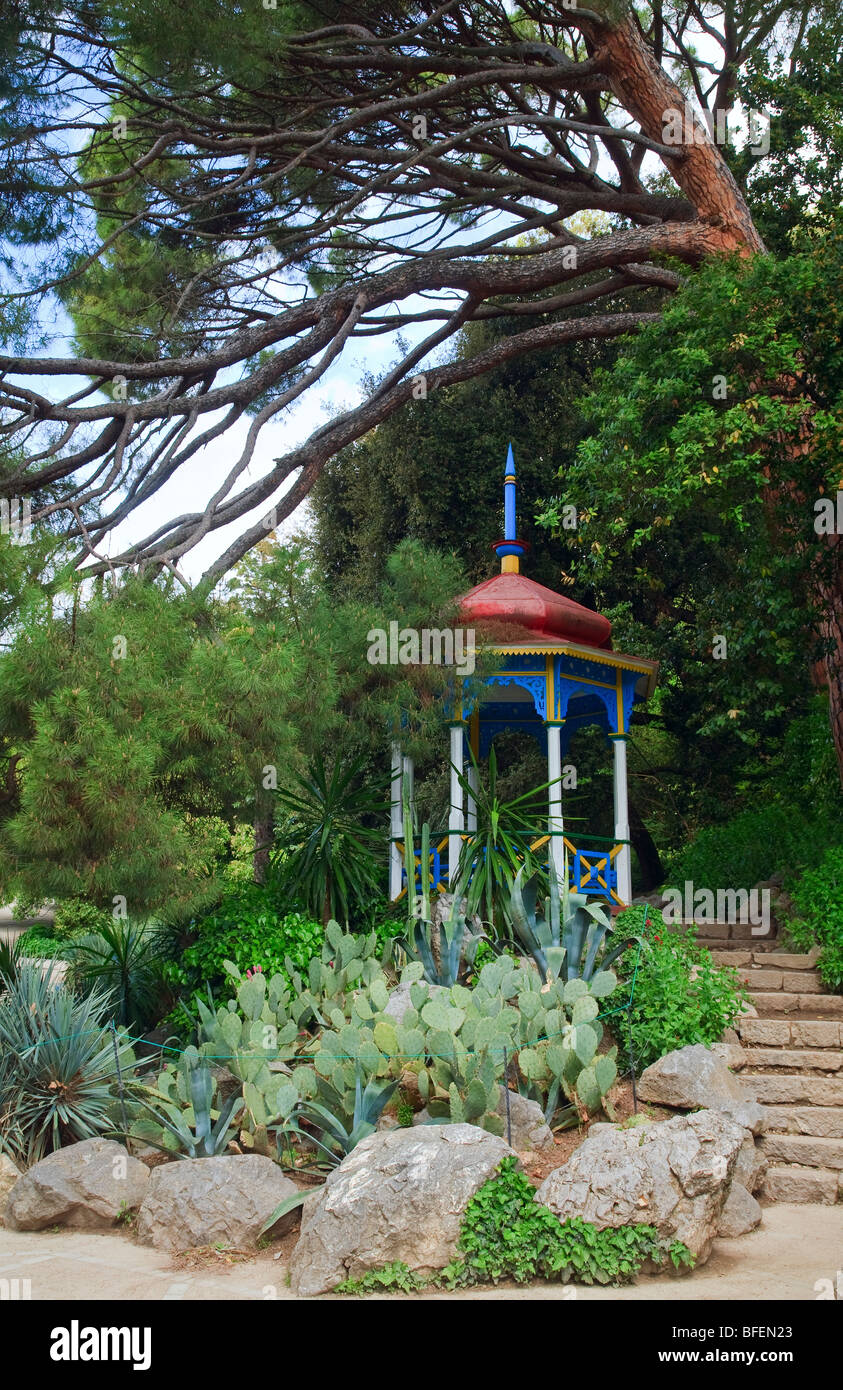 wooden varicoloured belvedere in spring park (Nikitsky Botanical Garden, Yalta, Crimea, Ukraine) Stock Photo