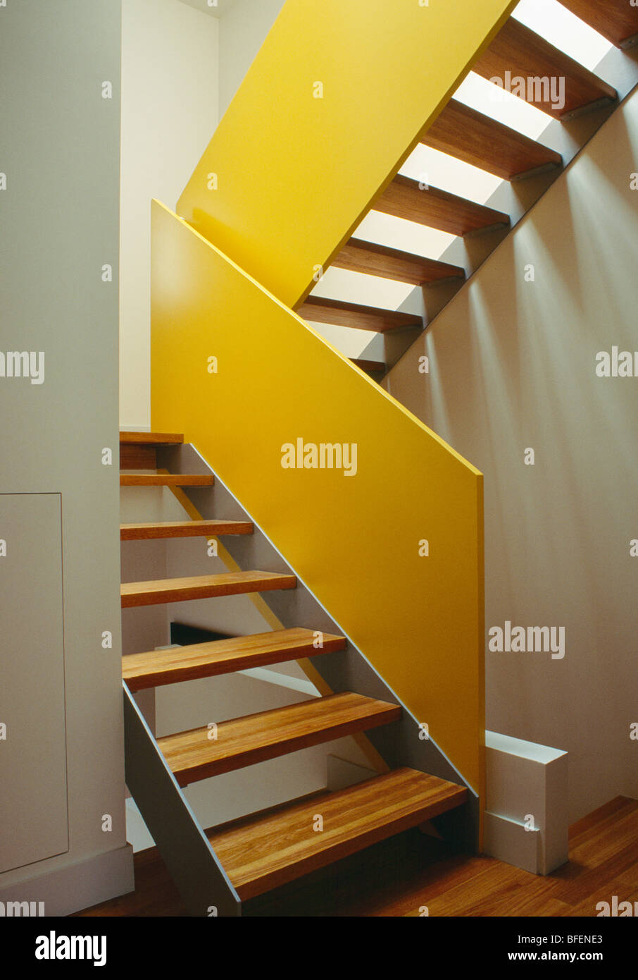 Modern Hall With Open Tread Staircase With Yellow Panelling Stock Photo Alamy