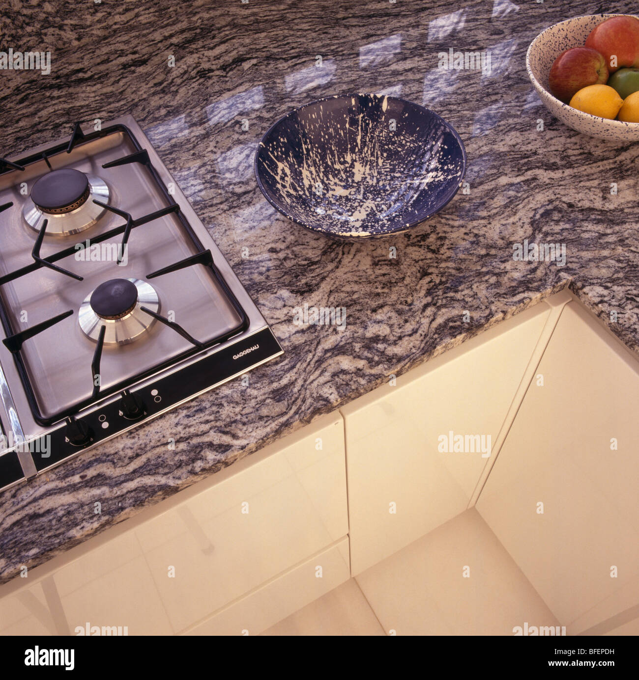 Birdseye Close Up Of Gas Hob In Fitted Kitchen Unit With Granite Worktop Stock Photo Alamy
