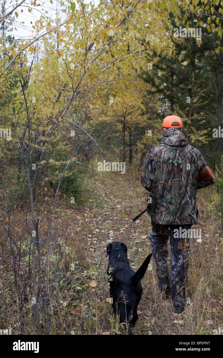 Man and dog hunting together in British Columbia, Canada Stock Photo