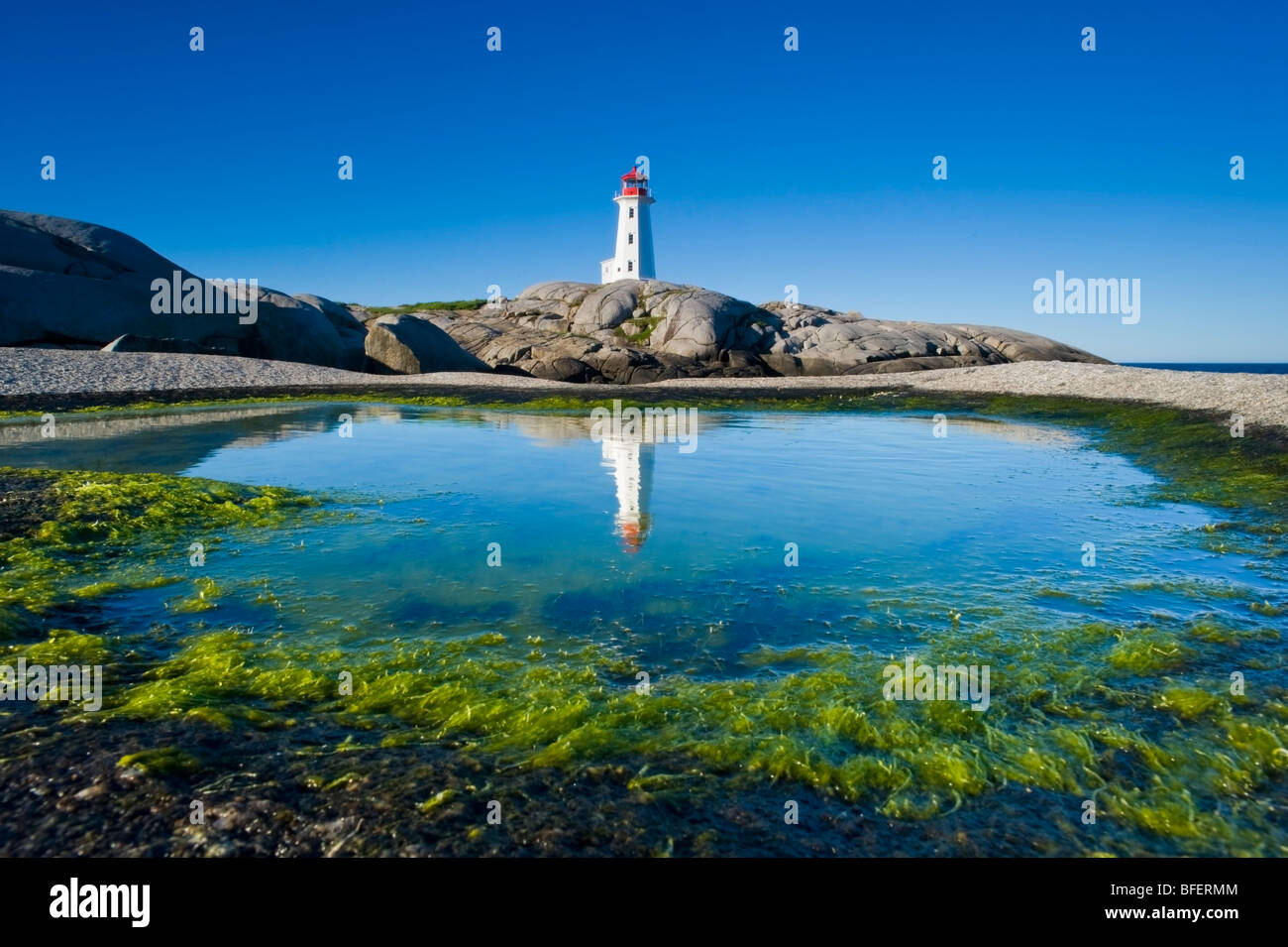 Lighthouse reflected in tide pool, Peggy's Cove, Nova Scotia, Canada Stock Photo Alamy