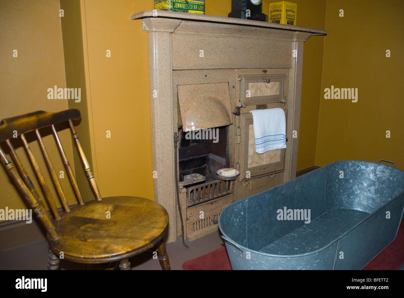 Bathing in front of the fire in tin bath, room setting in the Castle Museum in the City of York in Yorkshire in Northern England Stock Photo