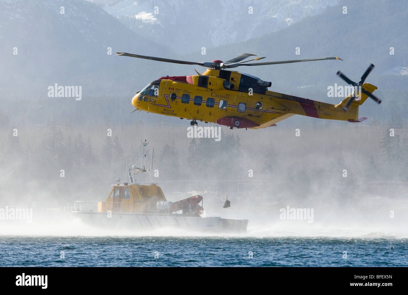 Condor Search Rescue Cormorant search and rescue helicopter hovers over a rescue boat during ...