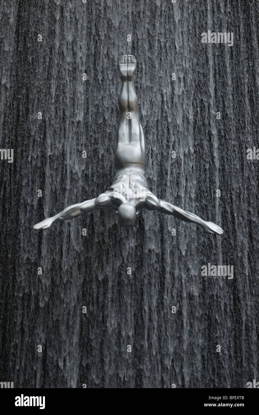 Detail of a human diving figure at the waterfall sculpture at The Dubai