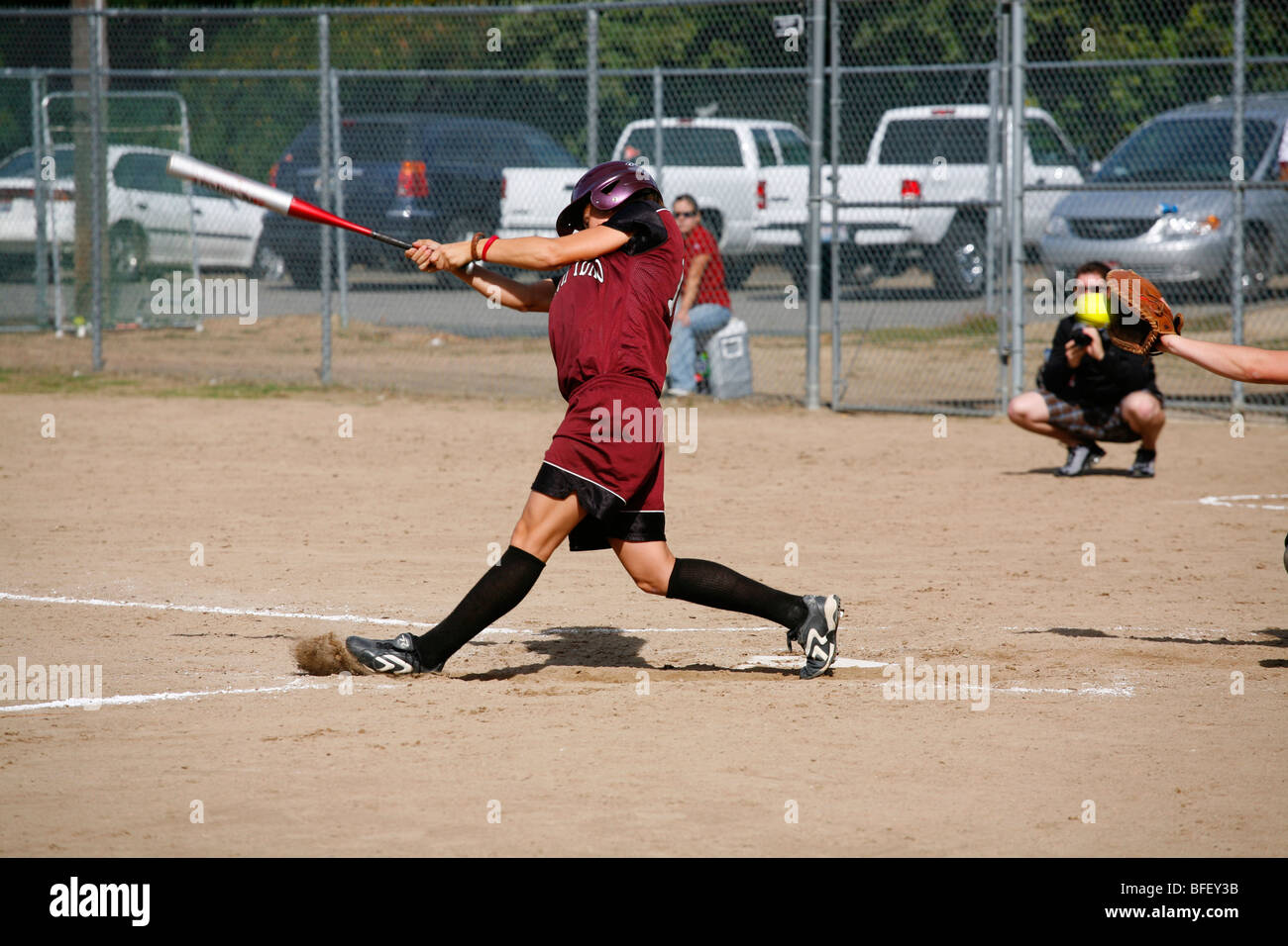 North Idaho College softball game, Sept. 28, 2008, Coeur D Alene, Idaho. Batter swinging and missing the pitch. Stock Photo