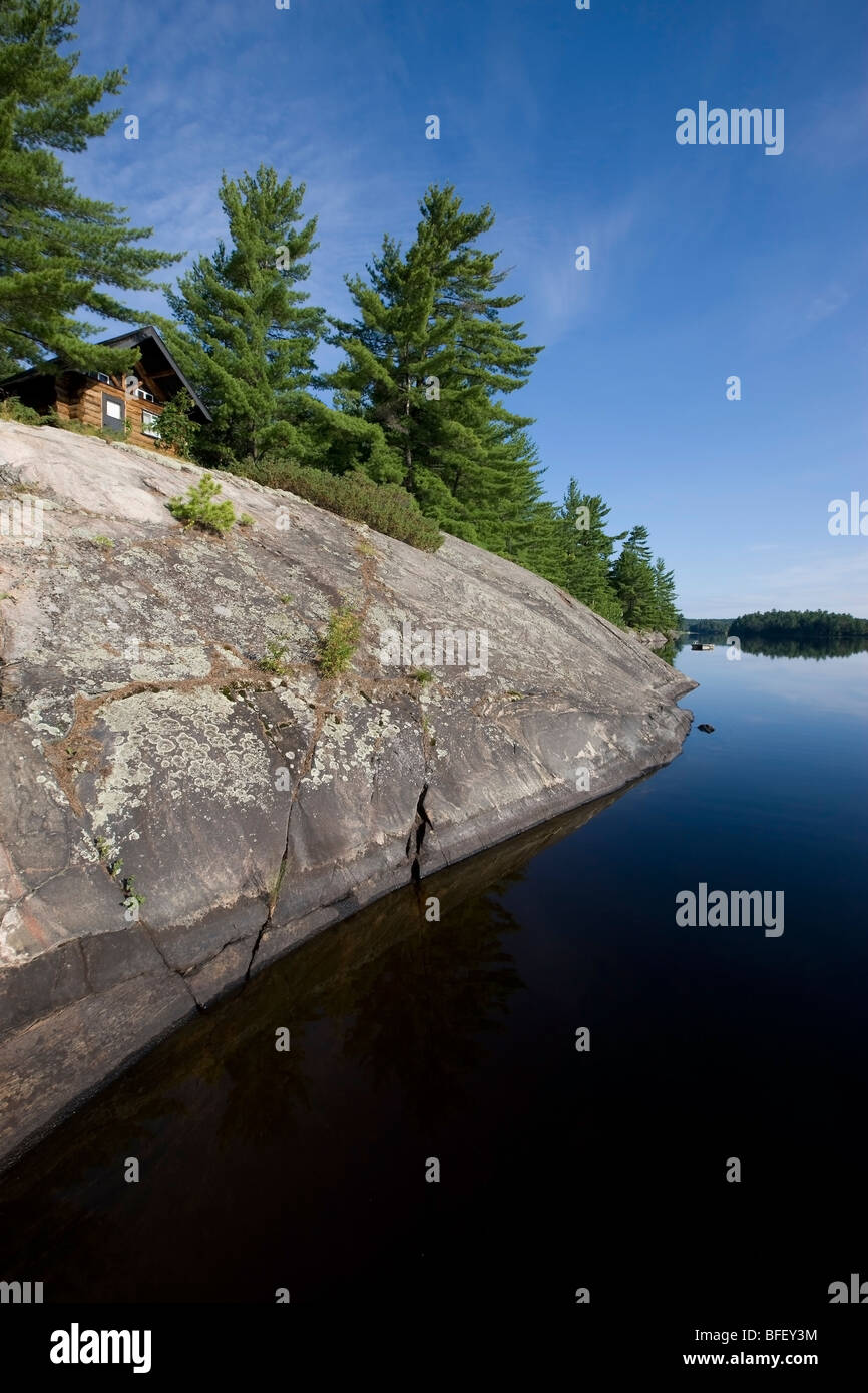 Cabin nestled amongst white pines on Rock Lake near Killarney, Ontario, Canada Stock Photo