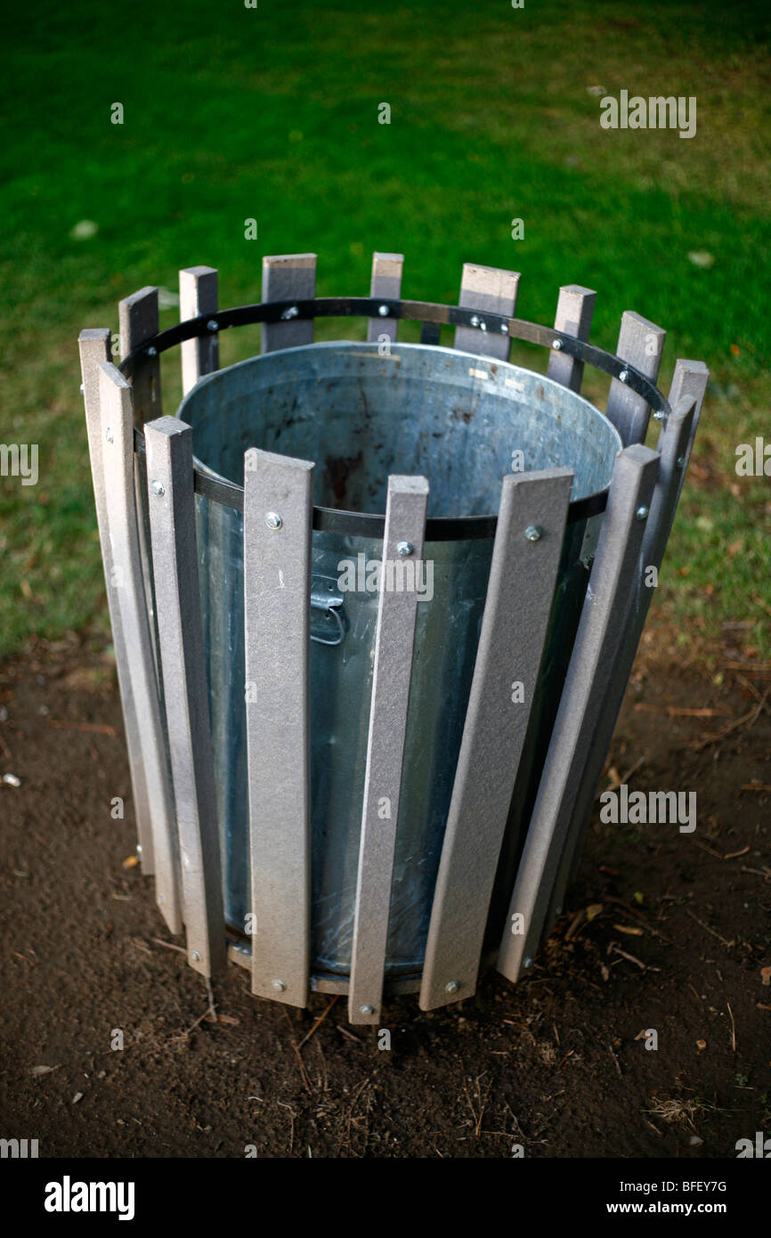 Trash can in a park setting Stock Photo Alamy