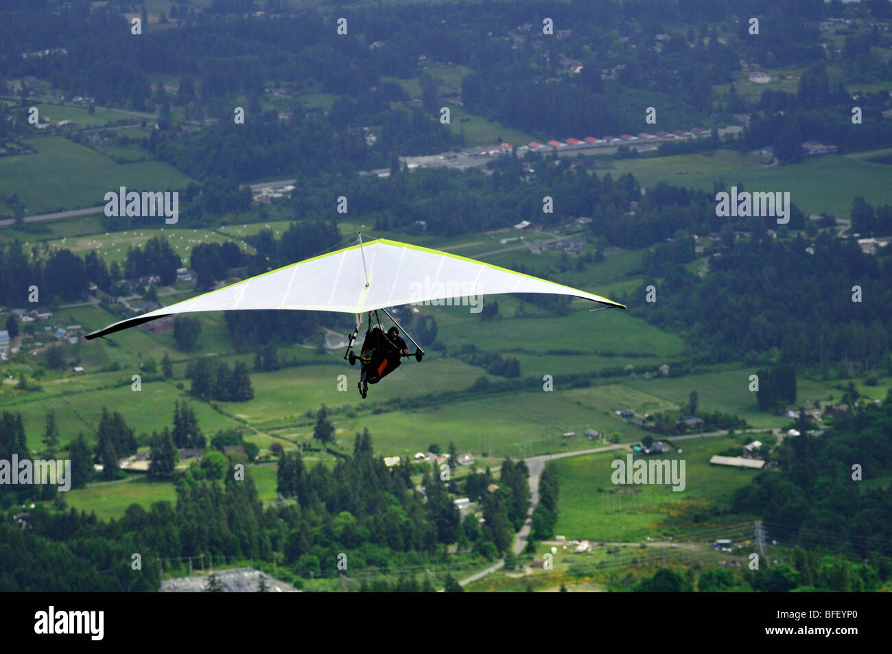 Hang glider off Mt. Prevost near Duncan, British Columbia, Canada Stock Photo