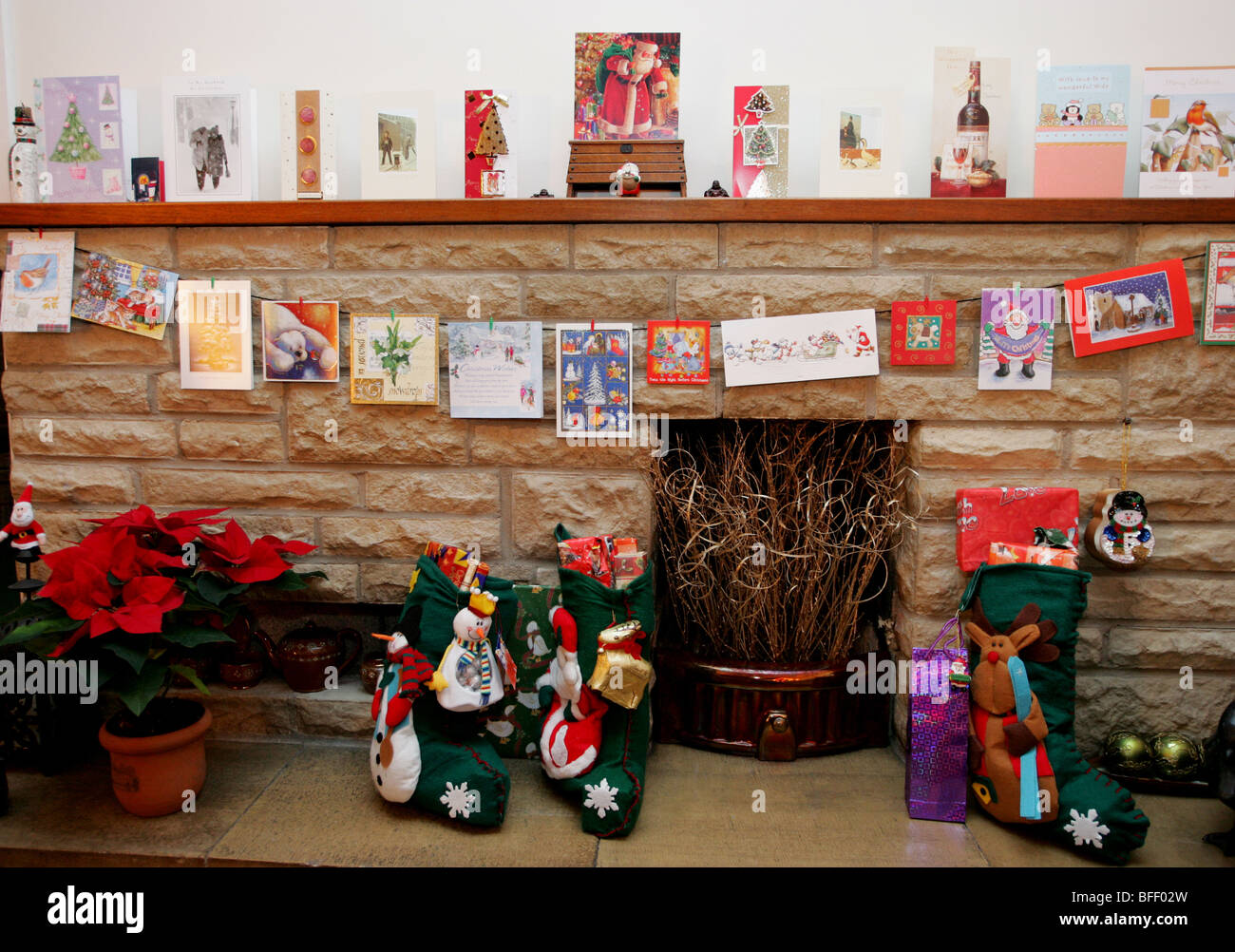 A typical British living room at Christmas with cards and stockings around  the fireplace Stock Photo - Alamy