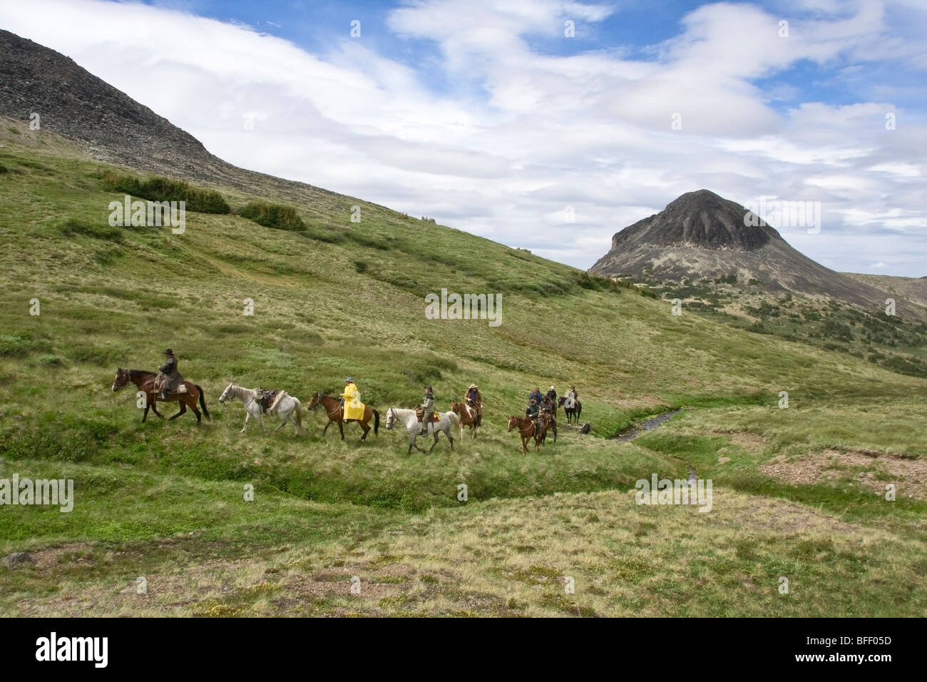 Group on a trail ride through the Itcha Mountains in British Columbia Canada Stock Photo