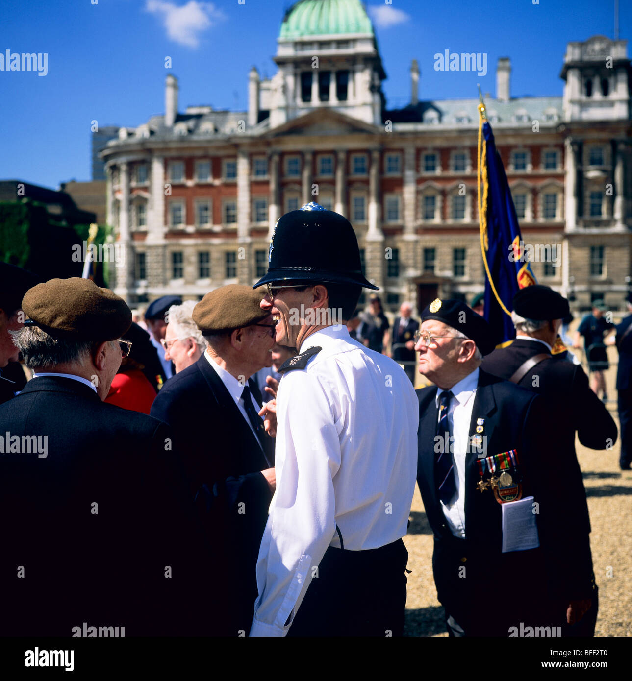 Police officer with Normandy veterans at D-Day remembrance parade at Whitehall London Great Britain Stock Photo