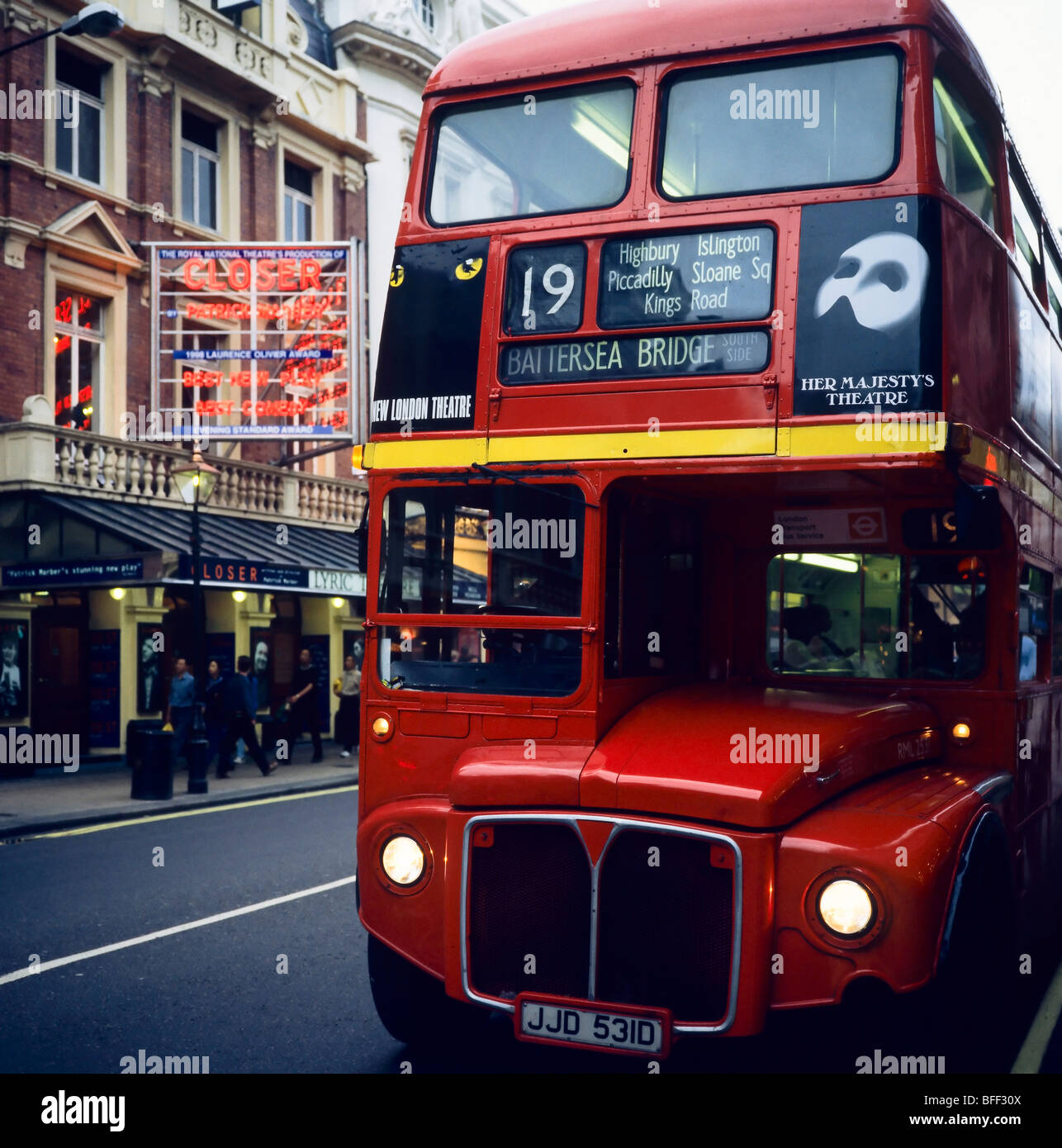 Red double decker Routemaster in Shaftesbury Avenue theatre district at dusk London Great Britain Stock Photo