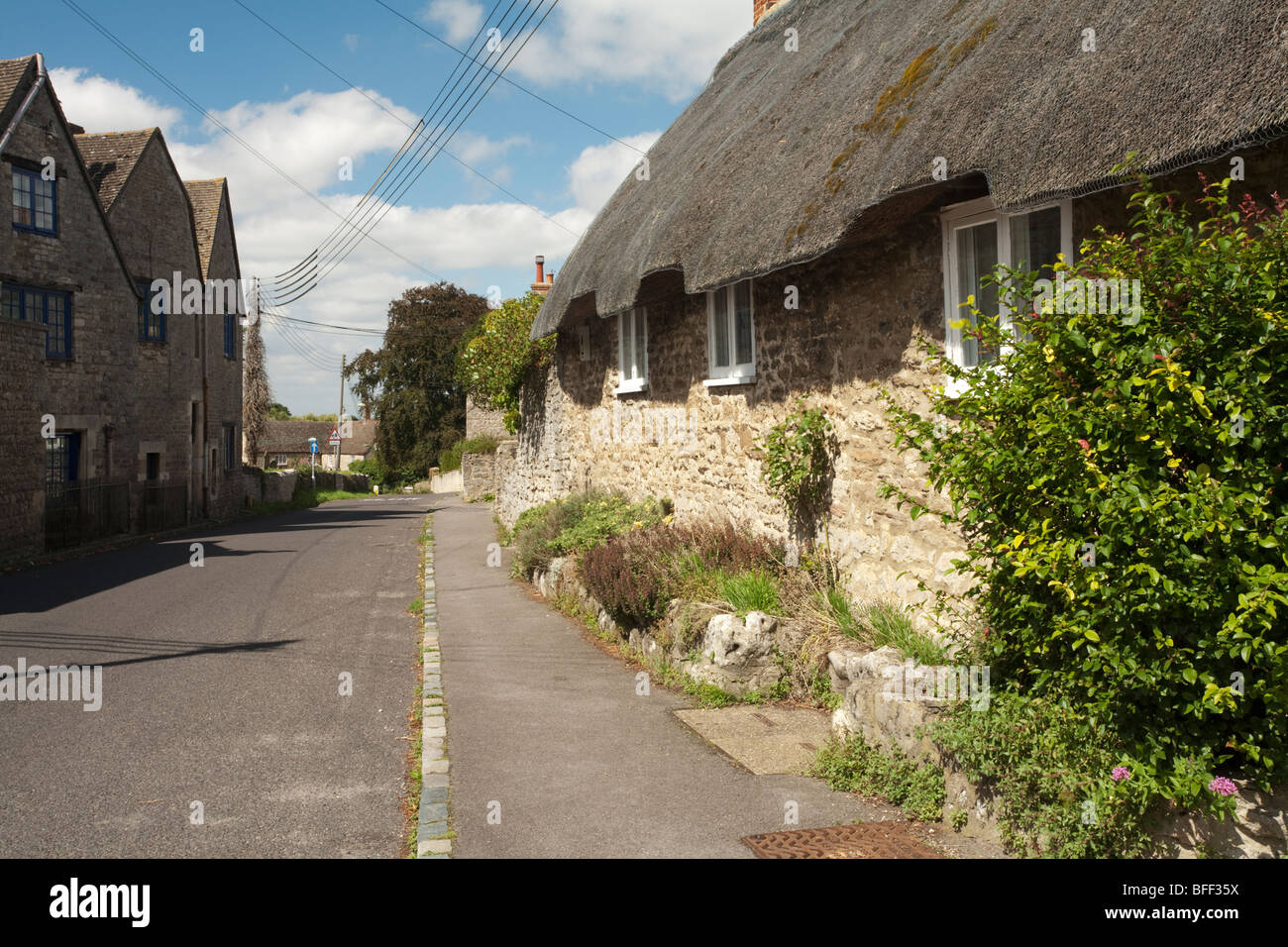 Thatched Cotswold cottages in the centre of Cumnor village in