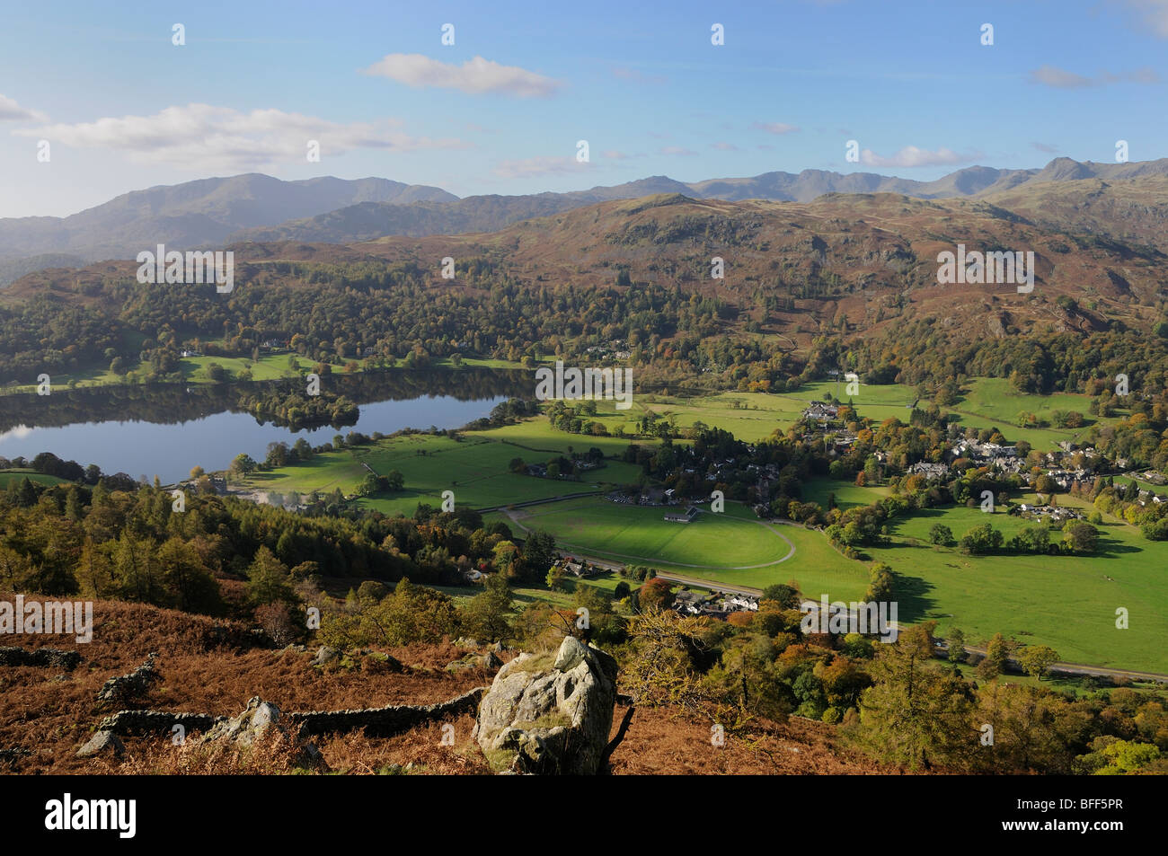 Looking southwest across Grasmere village and lake to Silver How from the slopes of Heron Pike with the Coniston fells visible Stock Photo