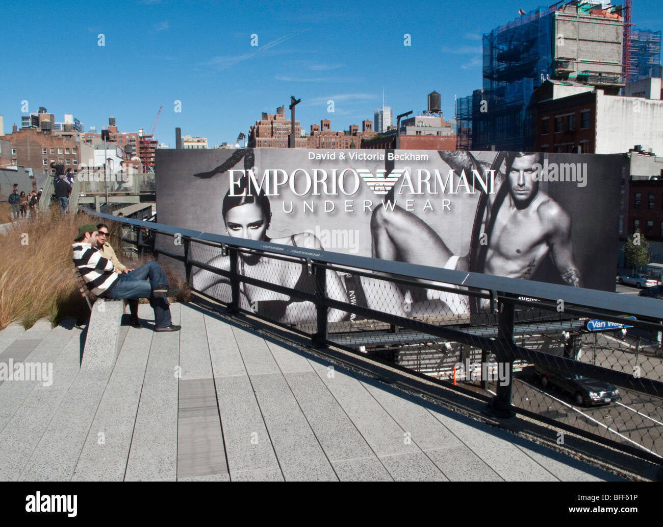 A young couple enjoys the view from the elevated High Line Park in the Chelsea district of New York City. Stock Photo