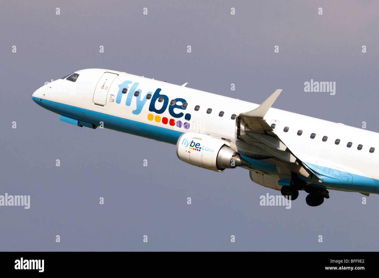 Embraer ERJ-190 operated by Flybe climbing out after taking off at Birmingham Airport Stock Photo