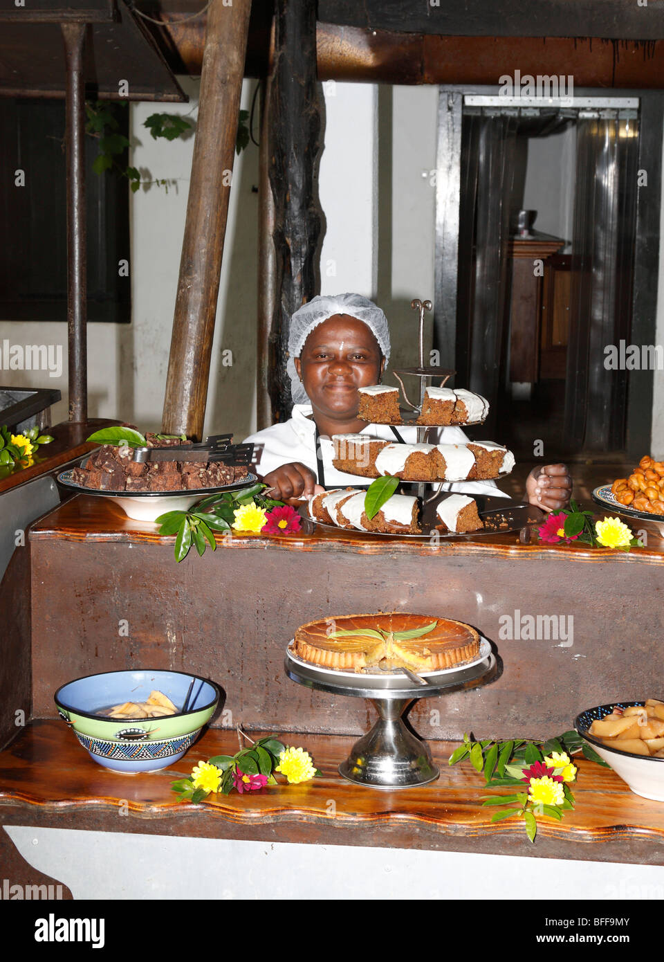 Female cook and African foods at Moyo Restaurant at Spier, Stellenbosch, West Cape, South Africa, November, 2009 Stock Photo