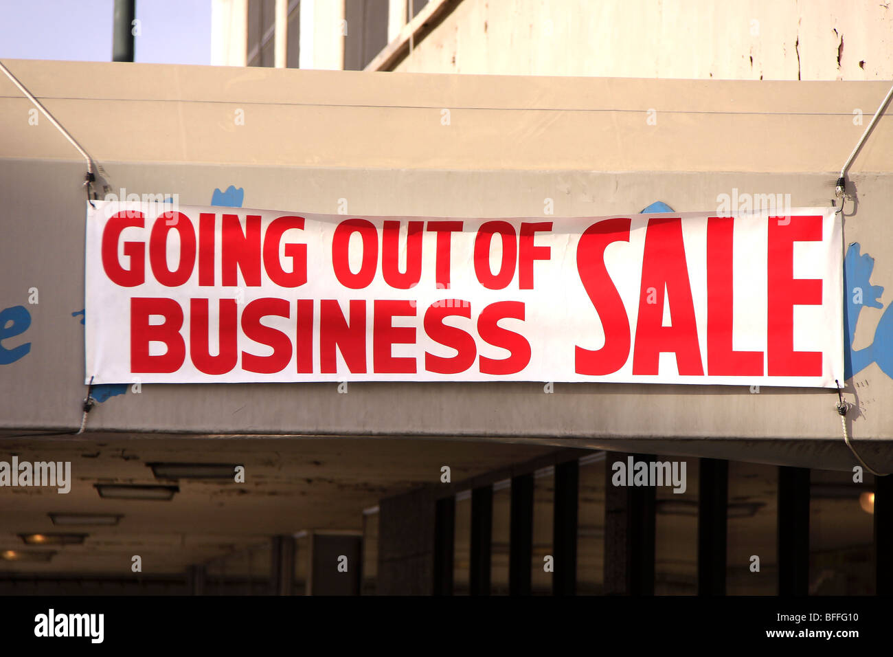 Signs on a building of a company going out of business Stock Photo