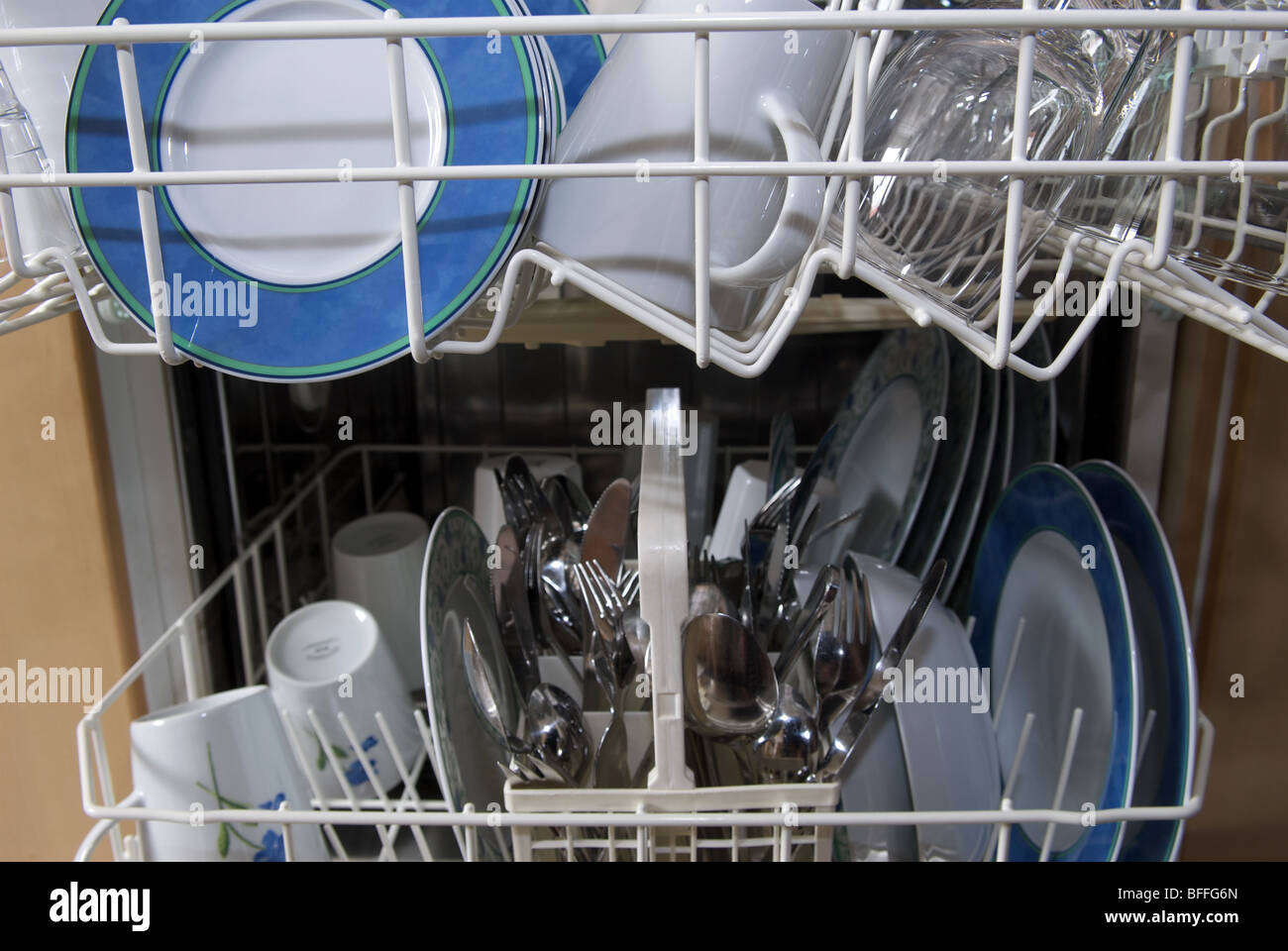 Dishwasher full of clean cutlery Stock Photo Alamy