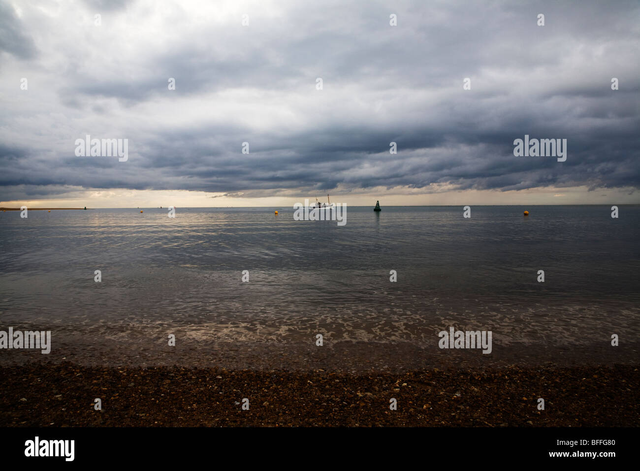 Fishing boat under low cloud Stock Photo