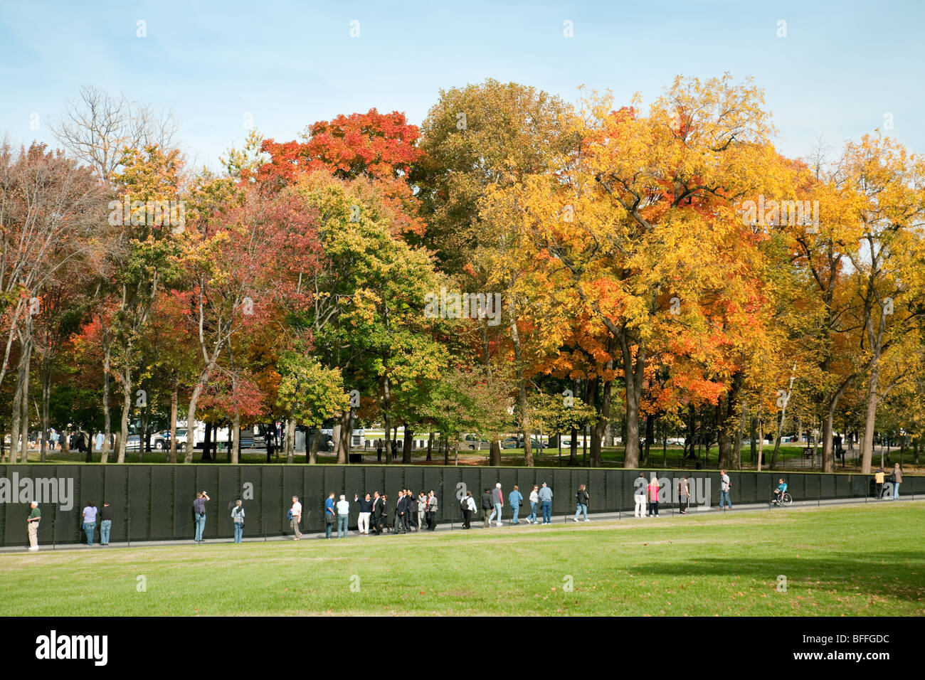 people at the Vietnam Veterans War Memorial in autumn fall, Washington DC USA Stock Photo