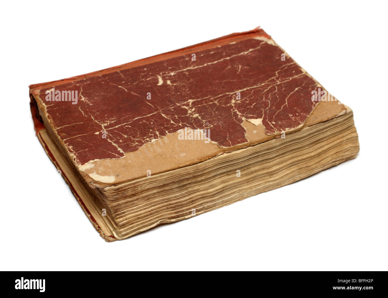 old damaged battered book on white background Stock Photo