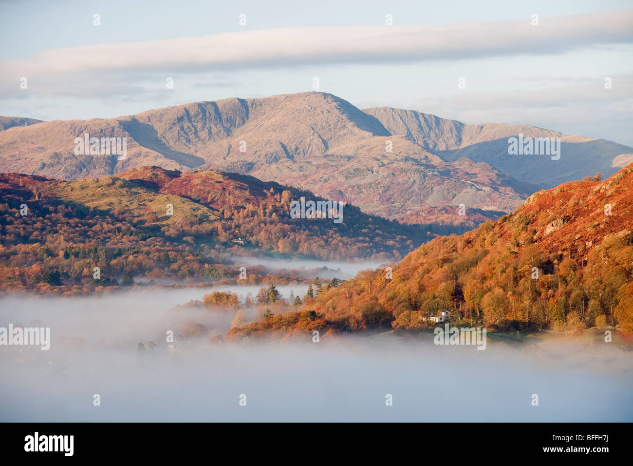 Mist caused by a temperature inversion over Ambleside in the Lake District, UK. Stock Photo