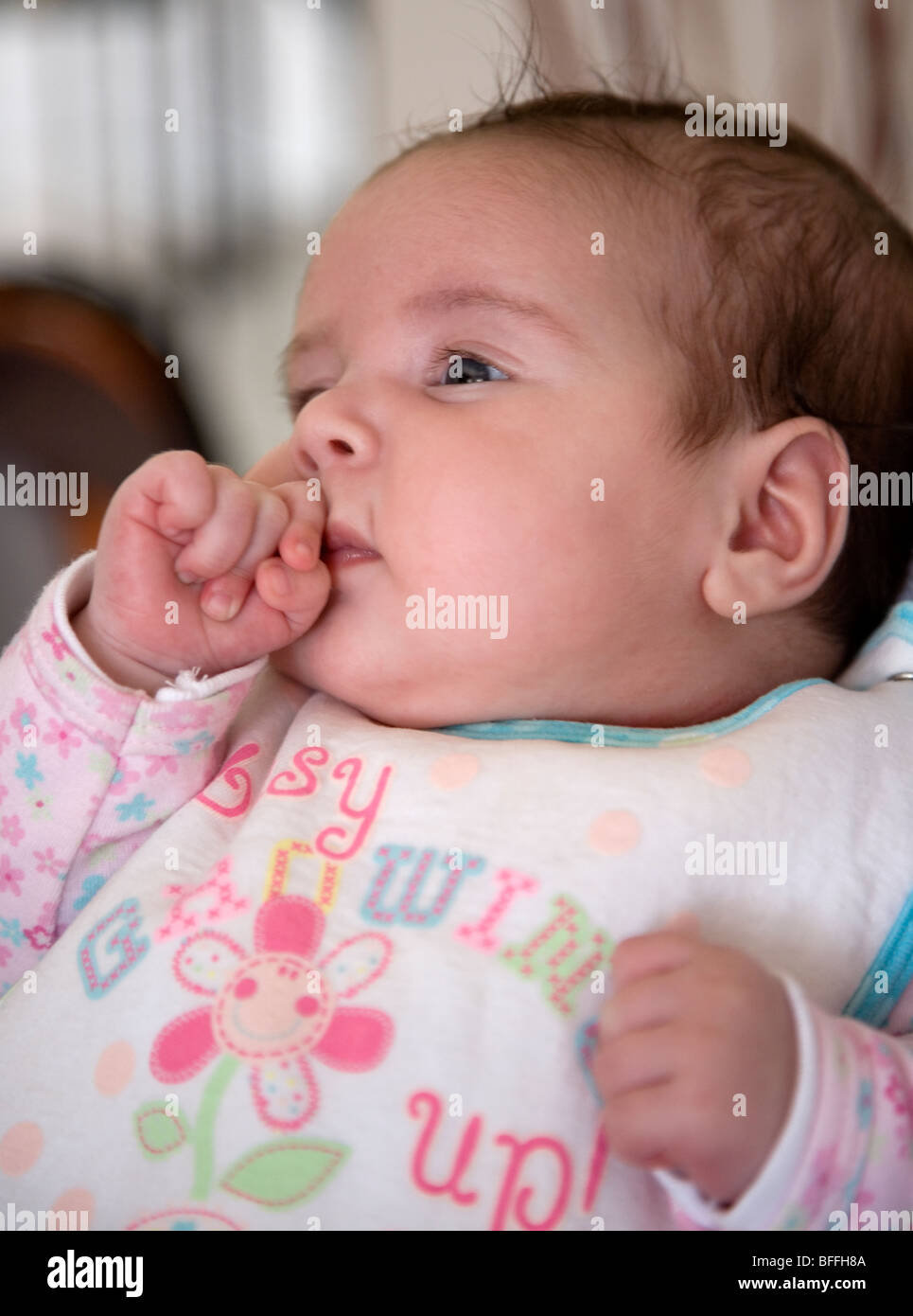 Baby hand in mouth Stock Photo Alamy