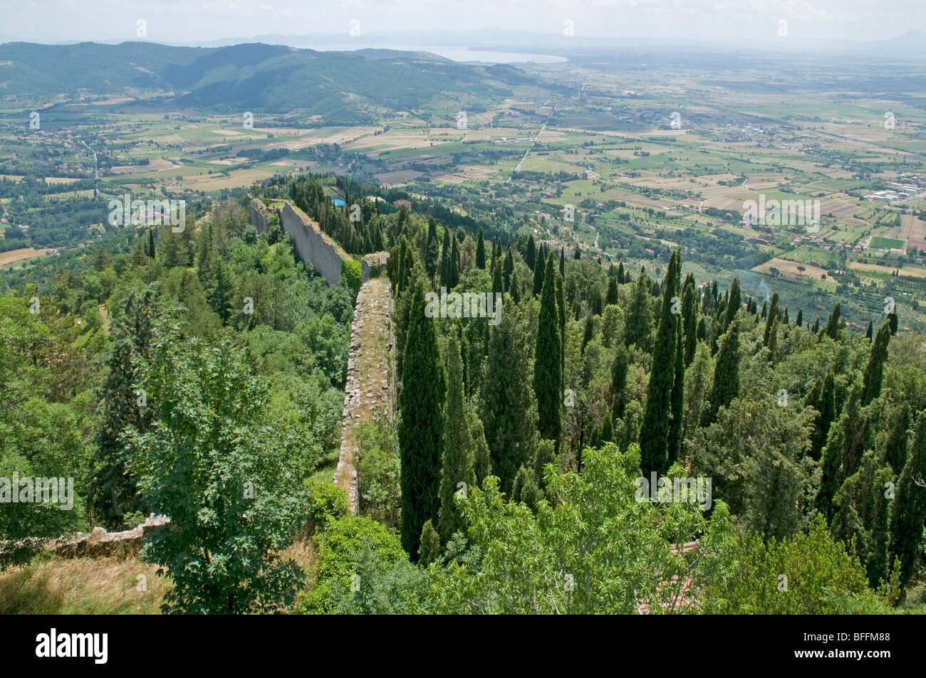 Looking south towards a distant Lake Trasimeno from the walls of the Fortezza Medicea, Cortona, Tuscany Stock Photo