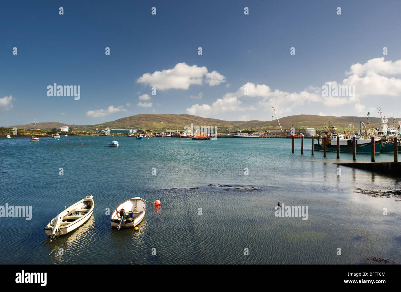 The harbour at Castletownbere, a fishing town on the Beara peninsula, west Cork, Ireland, with Bere Island in the background Stock Photo