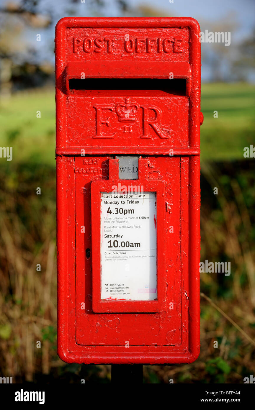 Traditional red post box down a country lane Stock Photo Alamy