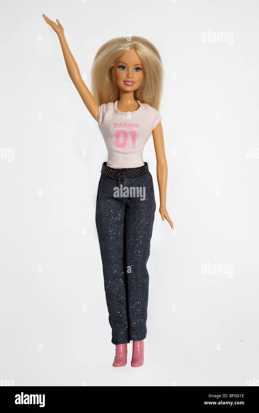 Barbie Doll wearing jeans and a top with arm raised Stock Photo - Alamy