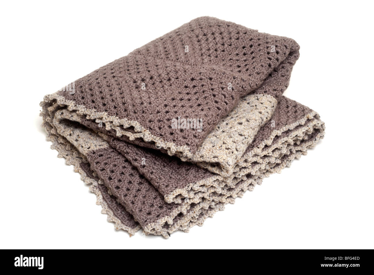 Brown and beige coloured crocheted blanket Stock Photo