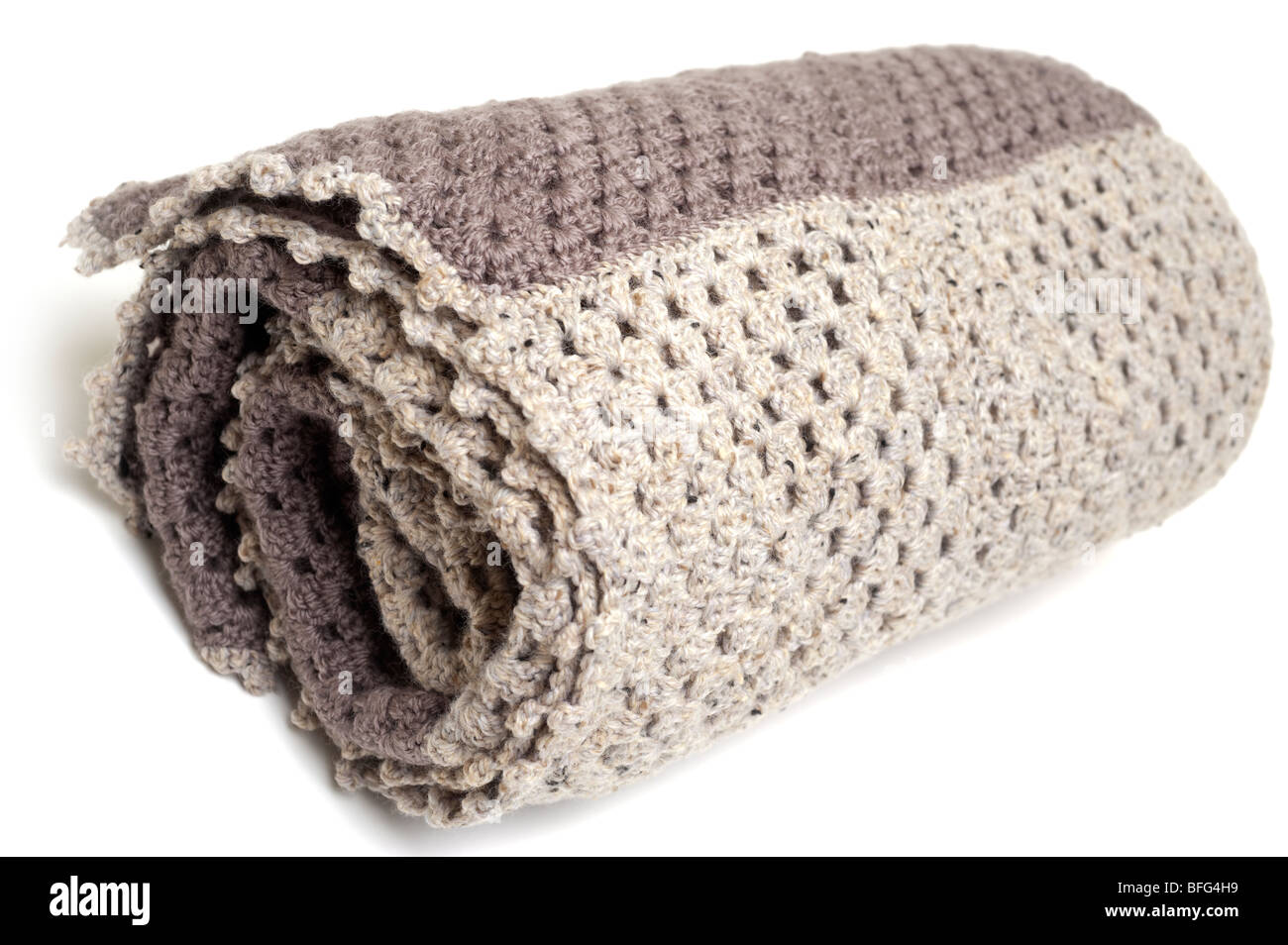 Brown and beige coloured crocheted blanket Stock Photo