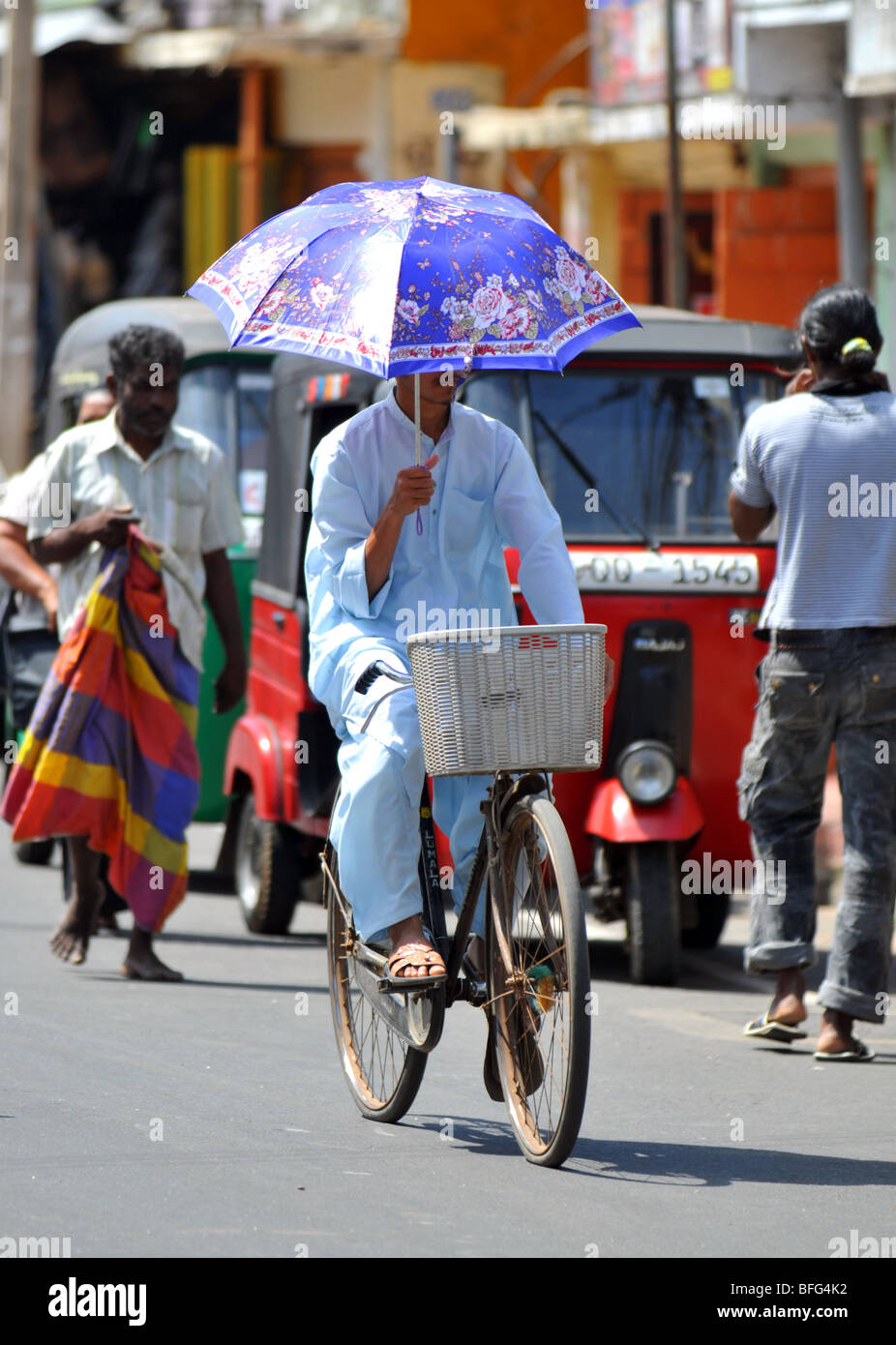 Man riding a bicycle, Sri Lanka Stock Photo