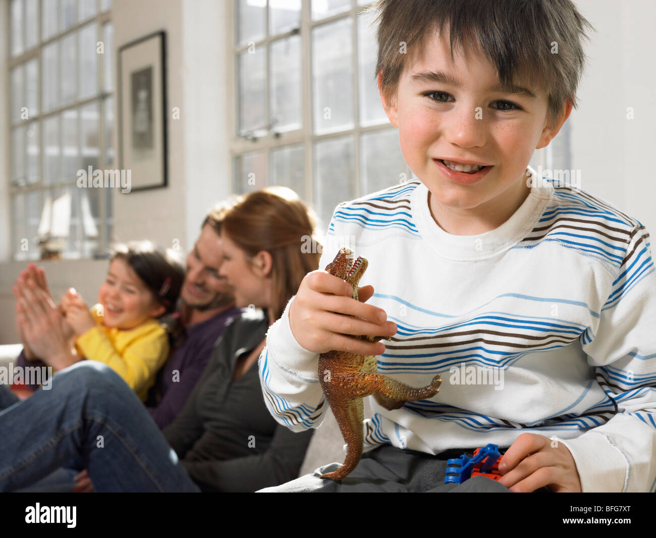 Boy holding toy dinosaur hi-res stock photography and images - Alamy