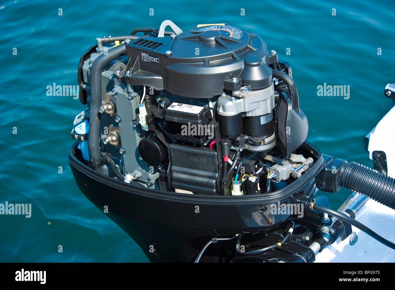 New 2009 model of Suzuki DF 60 outboard engine without cover on power boat transom Stock Photo
