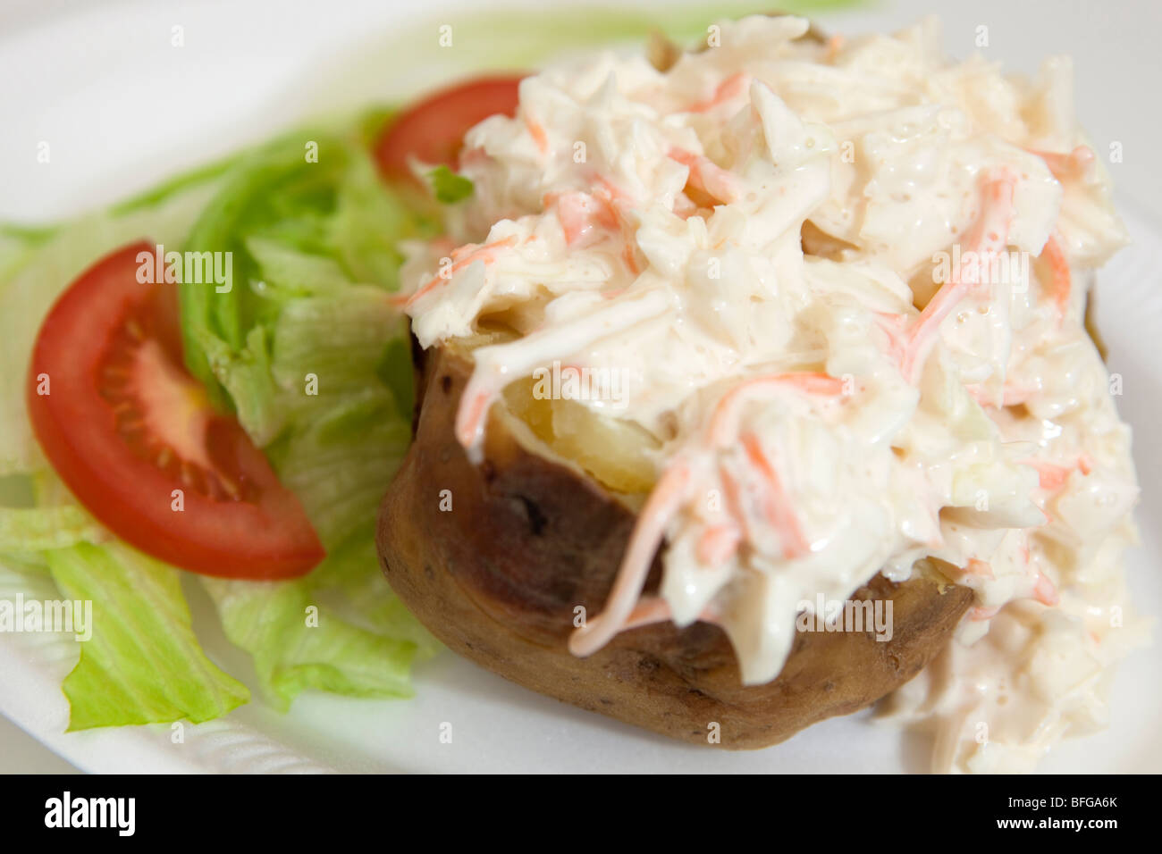 Coleslaw filling on Jacket Potato with Salad Garnish Stock Photo