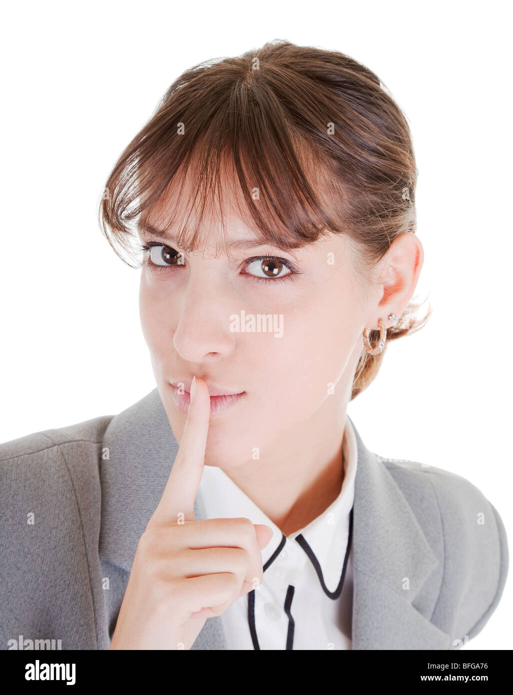 woman in business clothing requests to keep quiet Stock Photo