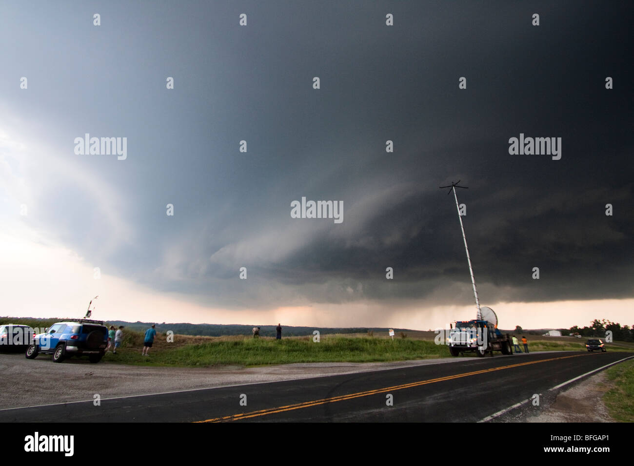 A doppler radar truck parked alongside the road in northwestern
