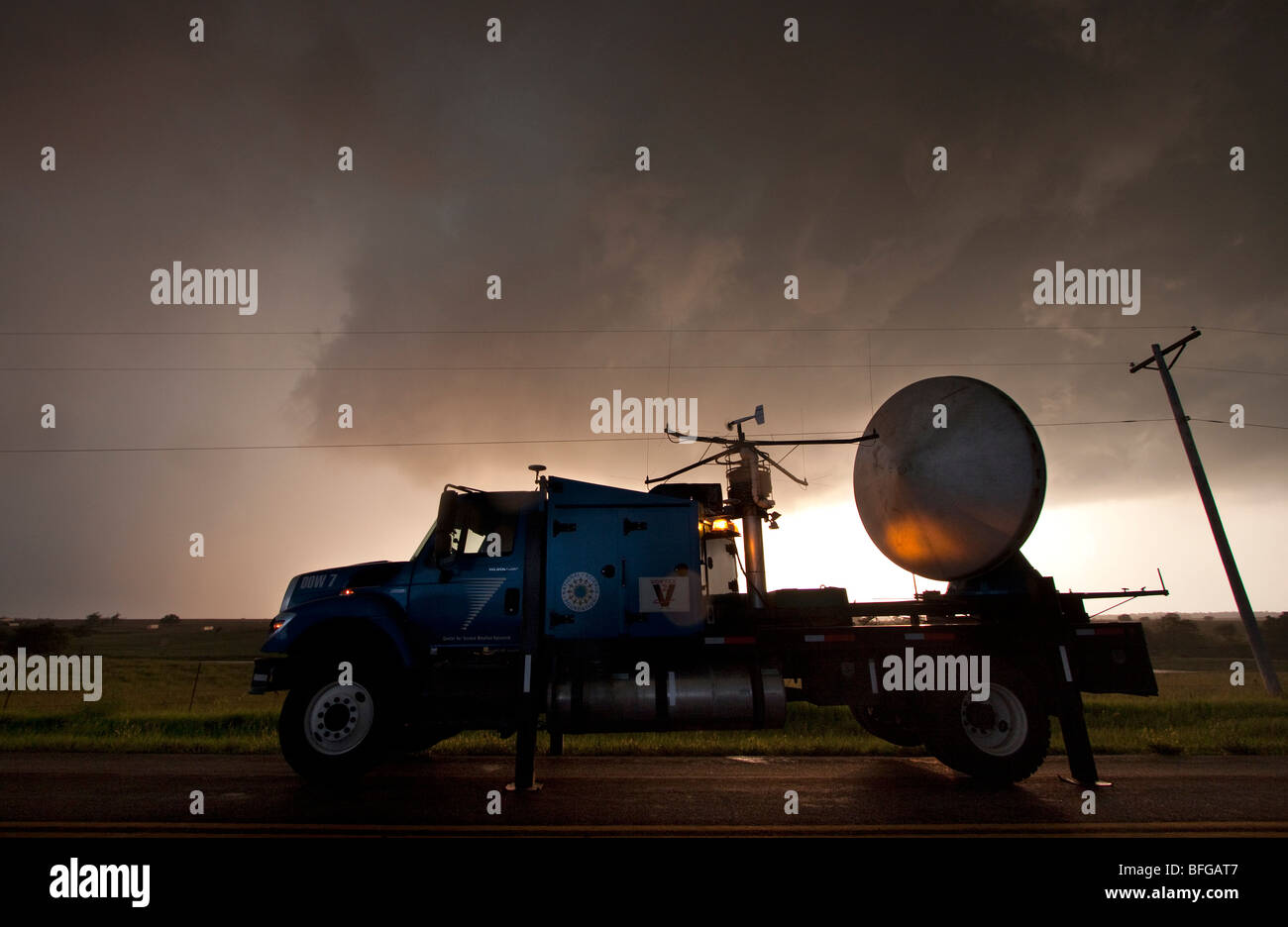 A doppler radar truck parked alongside the road in northwestern