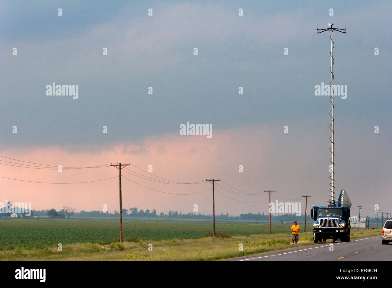 A doppler radar truck parked alongside the road in northwestern