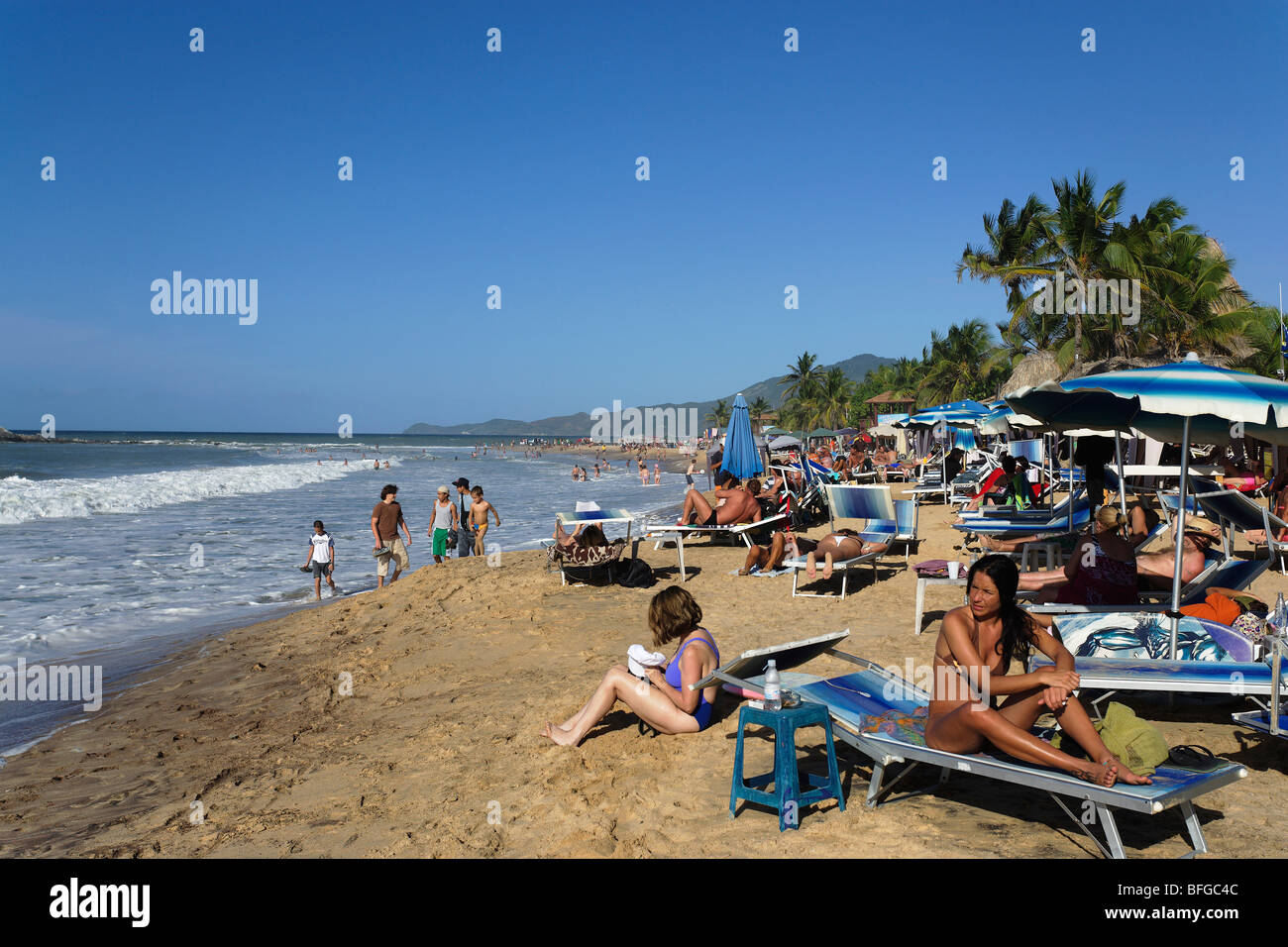 Tourists sunbathing at Playa Caribe, Pedro Gonzales, Isla Margarita, Nueva Esparta, Venezuela Stock Photo
