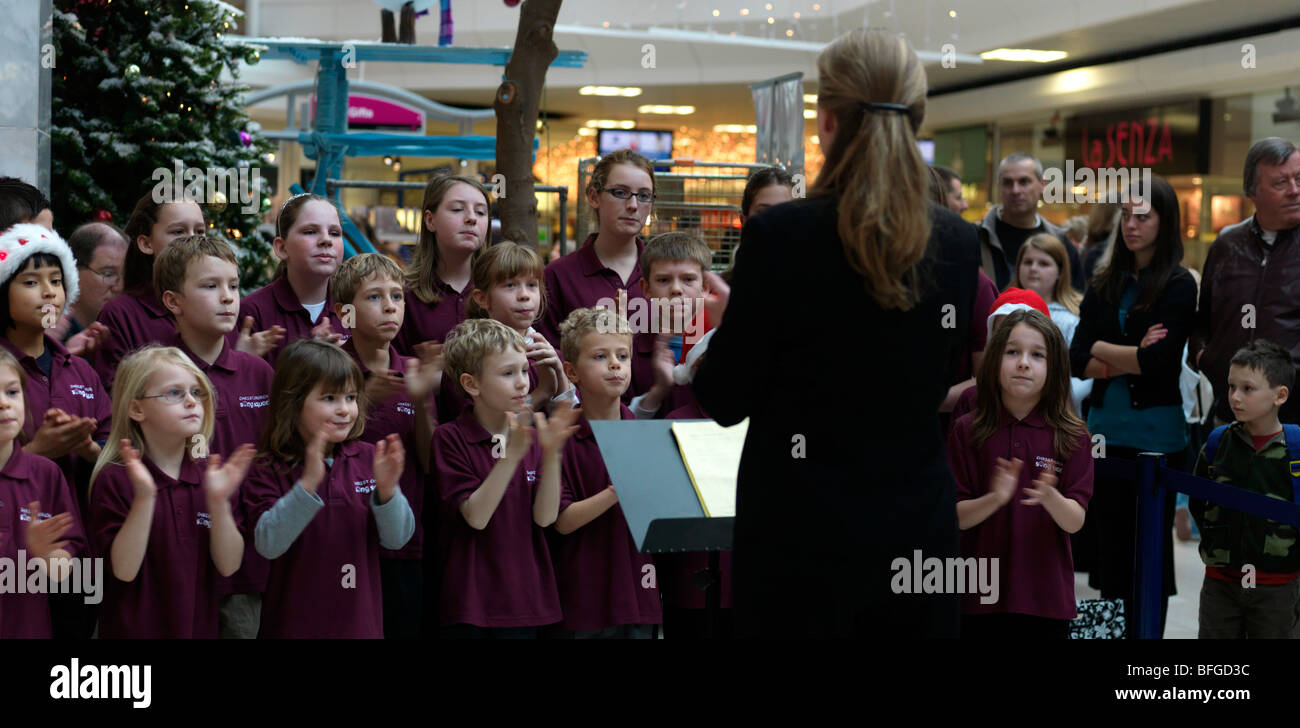 Children's Choir Singing Christmas Carols in the Town Centre Epsom Surrey Stock Photo