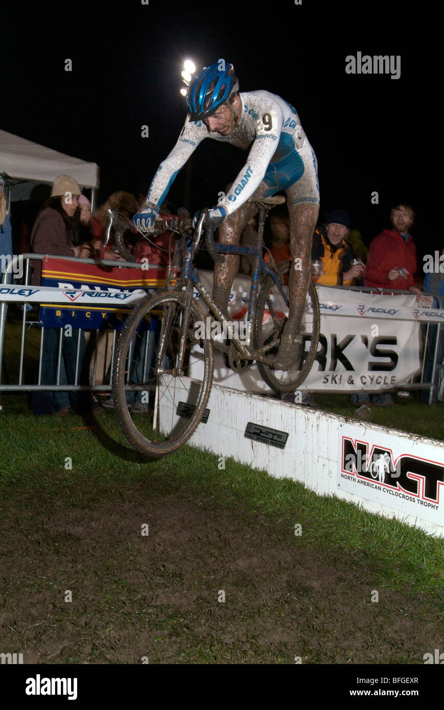 Cyclocross racer Adam Craig bunny hopping the barriers. Stock Photo