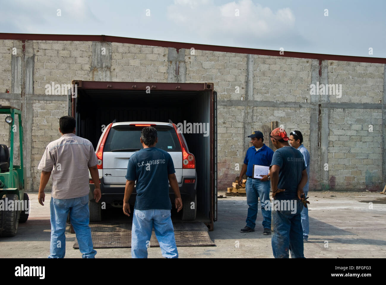 loading a car into a cargo container Stock Photo
