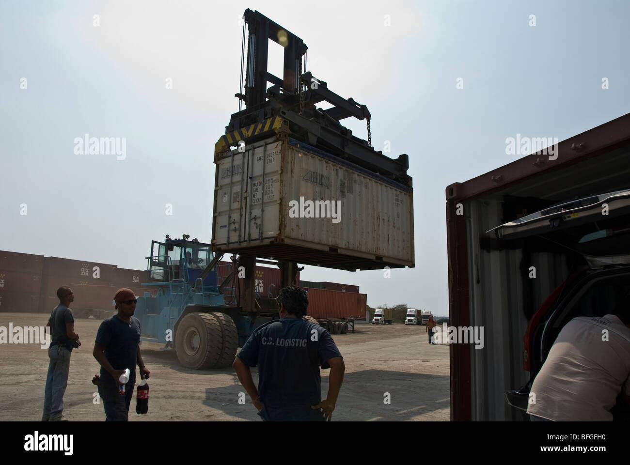 a crane lifting a cargo container Stock Photo